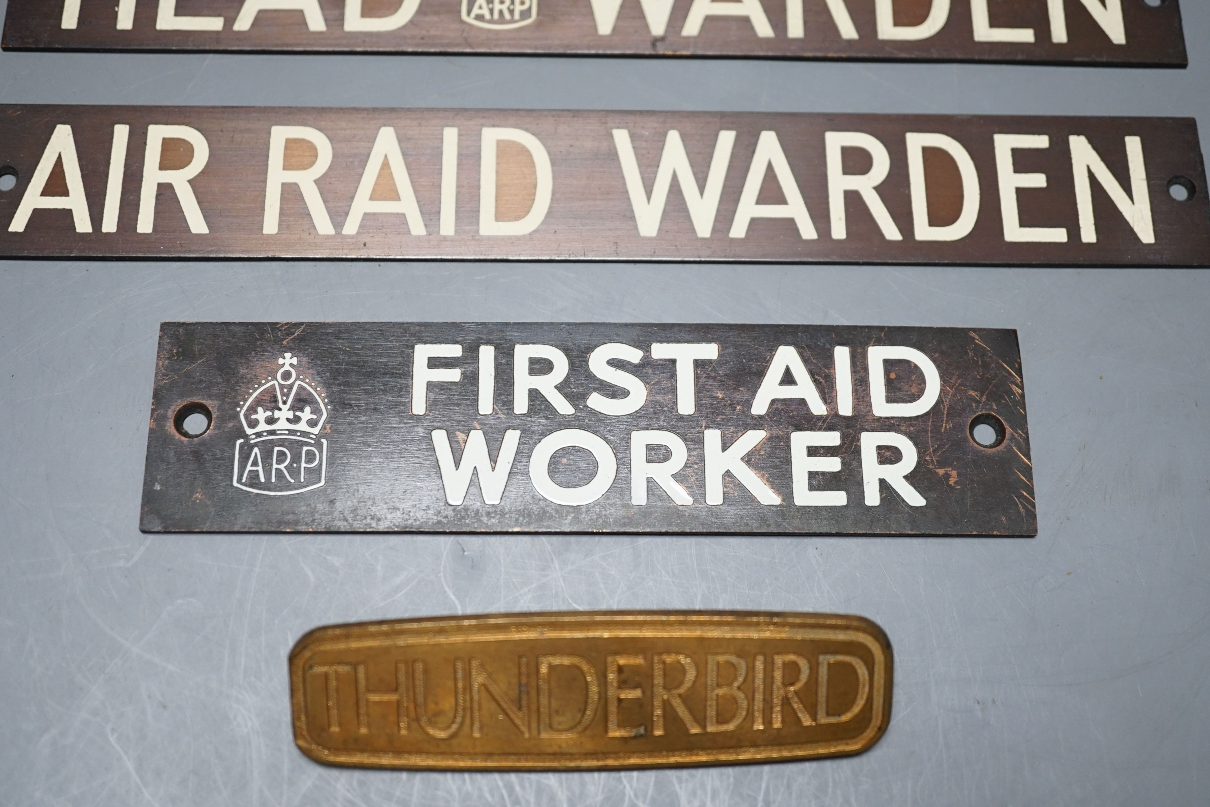 Three Air Raid Precautions signs together with a ‘Thunderbird’ sign. (4) largest 3 x 23cm